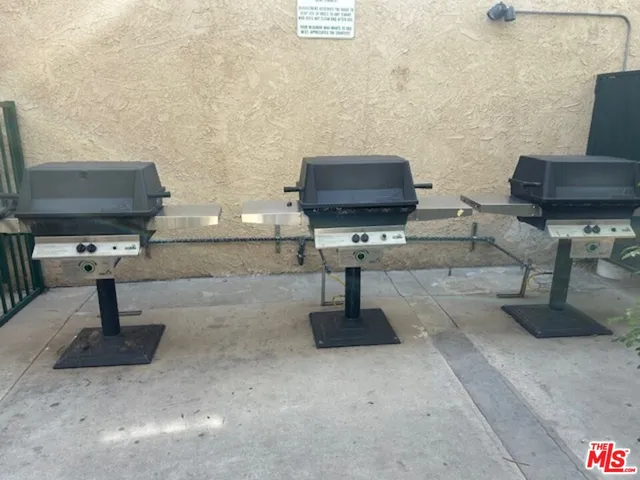 a living room with furniture and a lamp