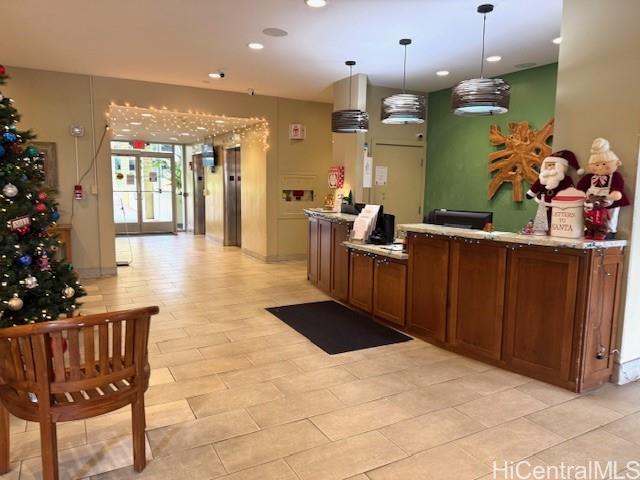 3161 Ala Ilima Street, Unit 107 Honolulu, HI 96818 - Photo 2 of 23 a lobby with furniture and flowers