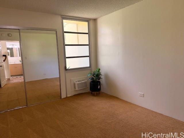 3161 Ala Ilima Street, Unit 107 Honolulu, HI 96818 - Photo 21 of 23 a view of an empty room with a window