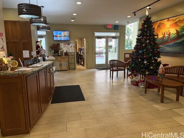 3161 Ala Ilima Street, Unit 107 Honolulu, HI 96818 - Photo 7 of 18 a lobby with furniture and a potted plants