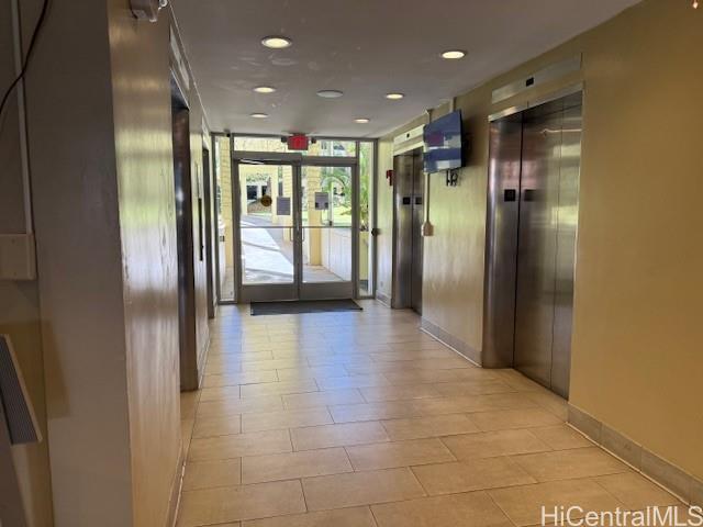 3161 Ala Ilima Street, Unit 107 Honolulu, HI 96818 - Photo 8 of 18 a view of a hallway with wooden floor