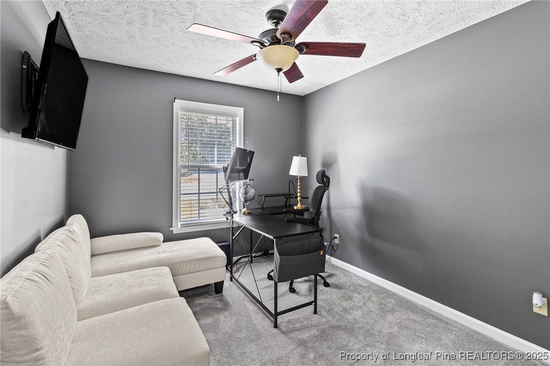 780 Wayside Road Raeford, NC 28376 - Photo 24 of 37 a living room with furniture and a window