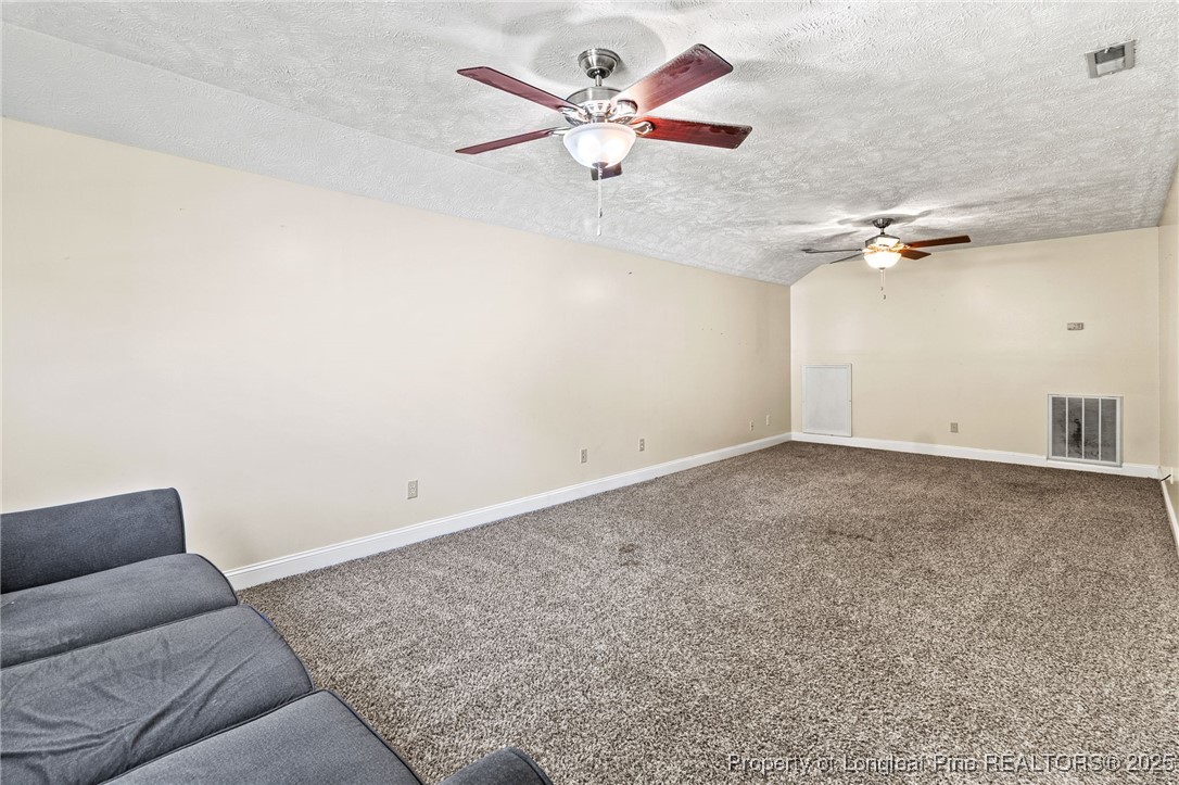780 Wayside Road Raeford, NC 28376 - Photo 29 of 37 a view of a livingroom with a ceiling fan