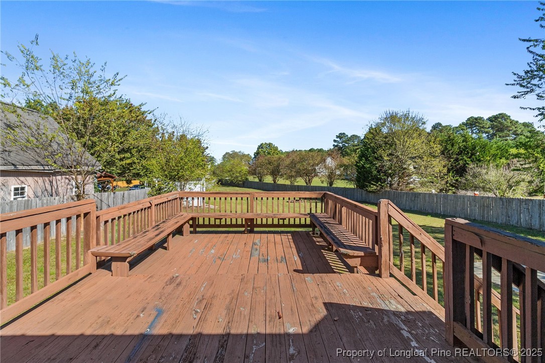 780 Wayside Road Raeford, NC 28376 - Photo 32 of 37 a view of balcony with wooden floor and fence
