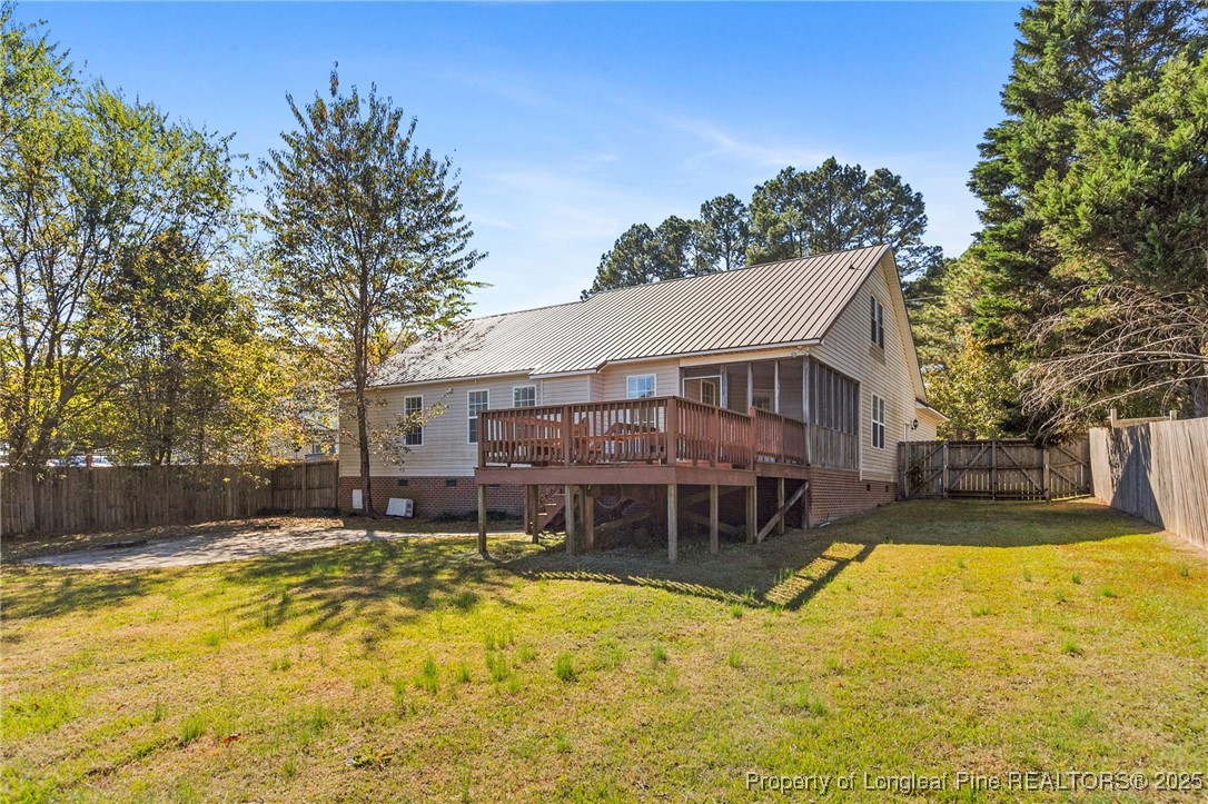 780 Wayside Road Raeford, NC 28376 - Photo 37 of 37 a view of a house with swimming pool next to a yard