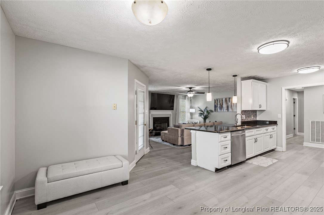 780 Wayside Road Raeford, NC 28376 - Photo 10 of 37 a large white kitchen with a large window