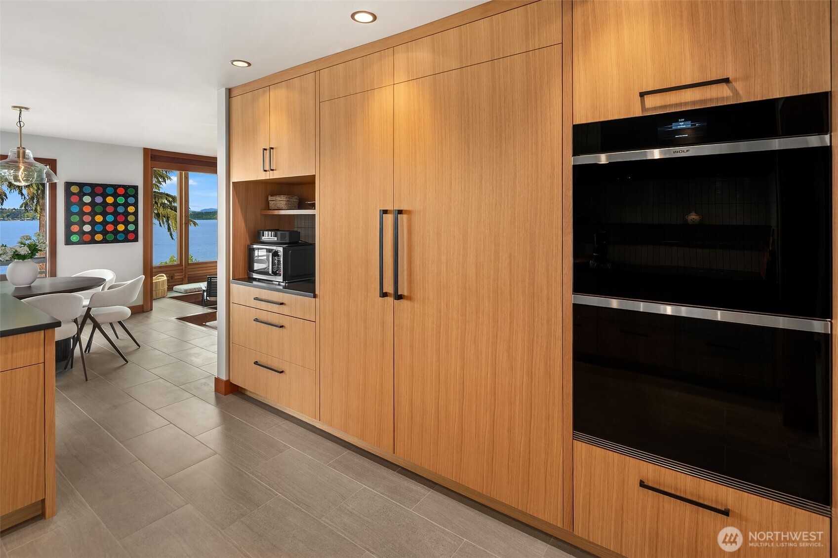 6814 Southwest Maury Park Road Vashon, WA 98070 - Photo 1 of 2 a kitchen with stainless steel appliances a refrigerator and cabinets
