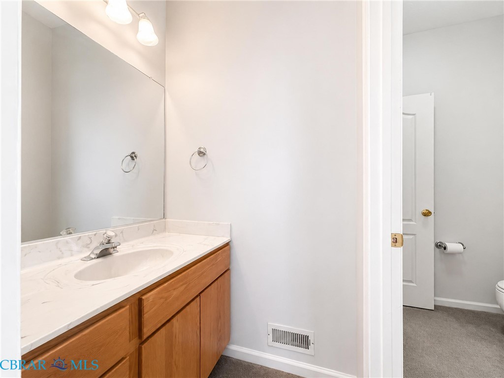 1214 Dandy Loop Road Yorktown, VA 23692 - Photo 33 of 65 a bathroom with a sink and a mirror