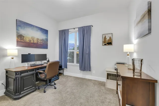 a view of a workspace with furniture