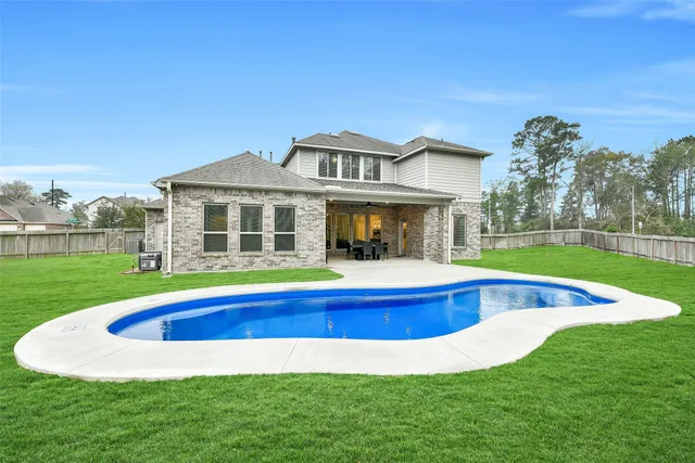 a dining room with a table and chairs