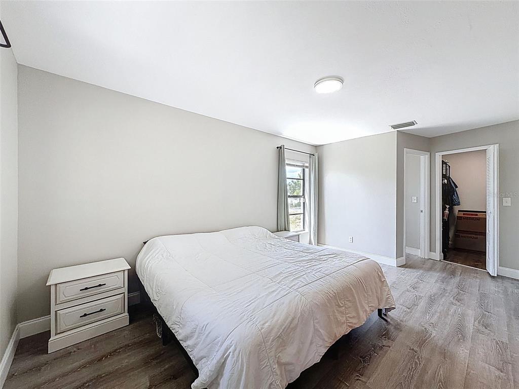 5384 Baldock Avenue Spring Hill, FL 34608 - Photo 25 of 51 a bedroom with a bed and a dresser
