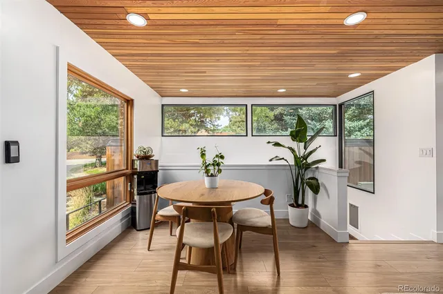 a view of a dining room with furniture and window