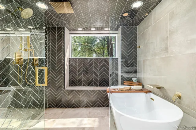 a bathroom with a bathtub and shower