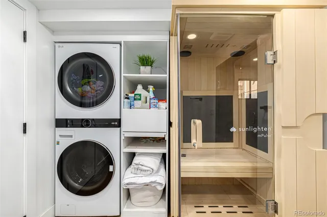 a view of a hallway with washer and dryer