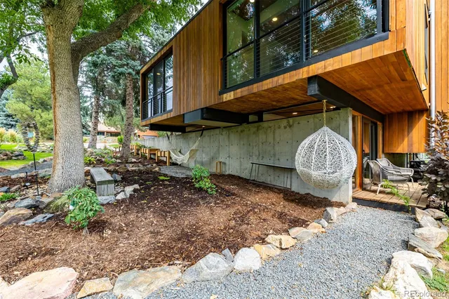 a view of a barn with a yard and plants