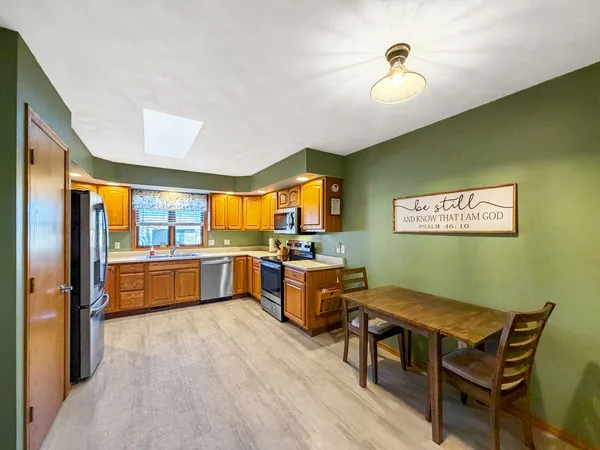 a kitchen with a table and chairs
