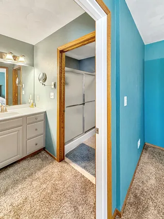 a view of walk in closet and bedroom view