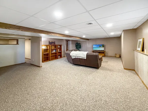 a big room with furniture and a window