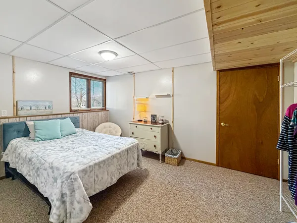 a bedroom with a bed and a walk in closet