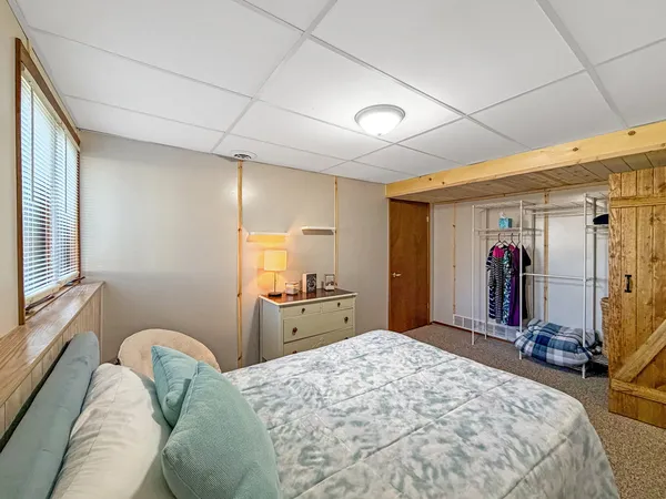 a bed room with a bed and a window