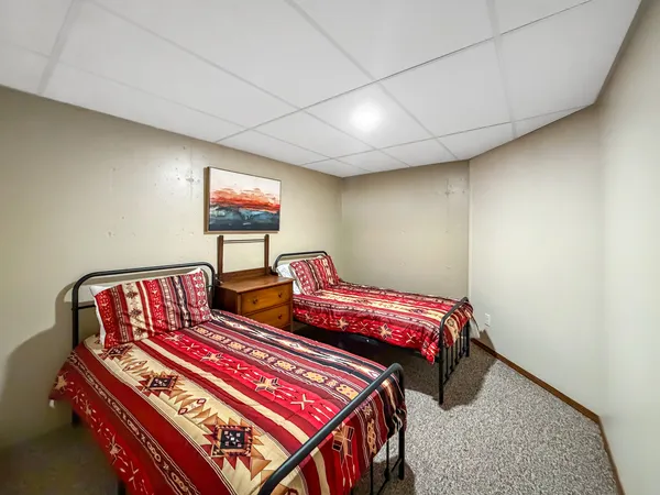 a bedroom with furniture and a window
