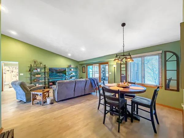 a view of a dining room with furniture window and outside view