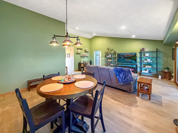 a dining room with furniture and window
