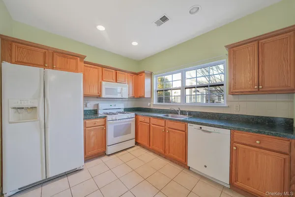 a view of kitchen with furniture and chandelier