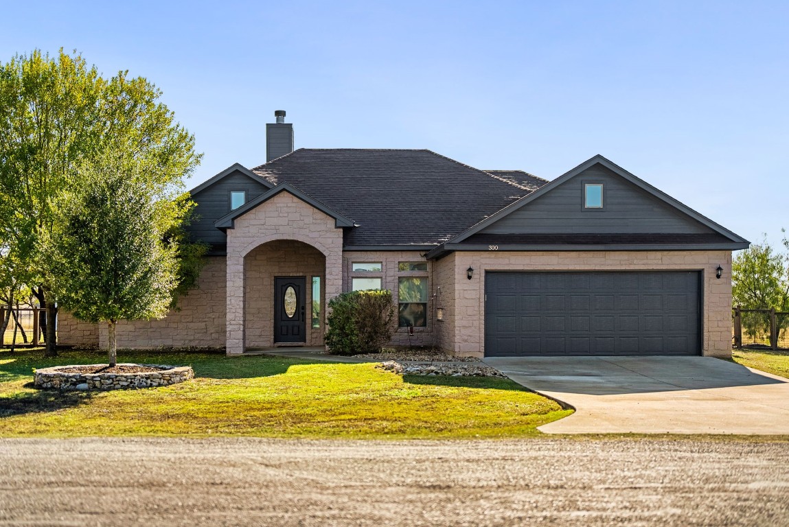 300 Engelke Road Kyle, TX 78640 - Photo 1 of 1 a front view of a house with swimming pool