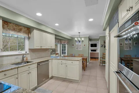 a kitchen with a sink stainless steel appliances and cabinets