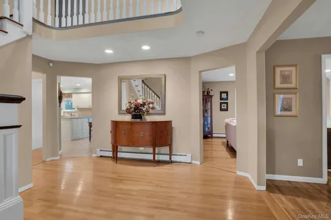 a view of a livingroom with furniture and an entryway