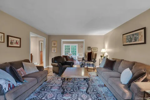 a living room with furniture or couch and a window