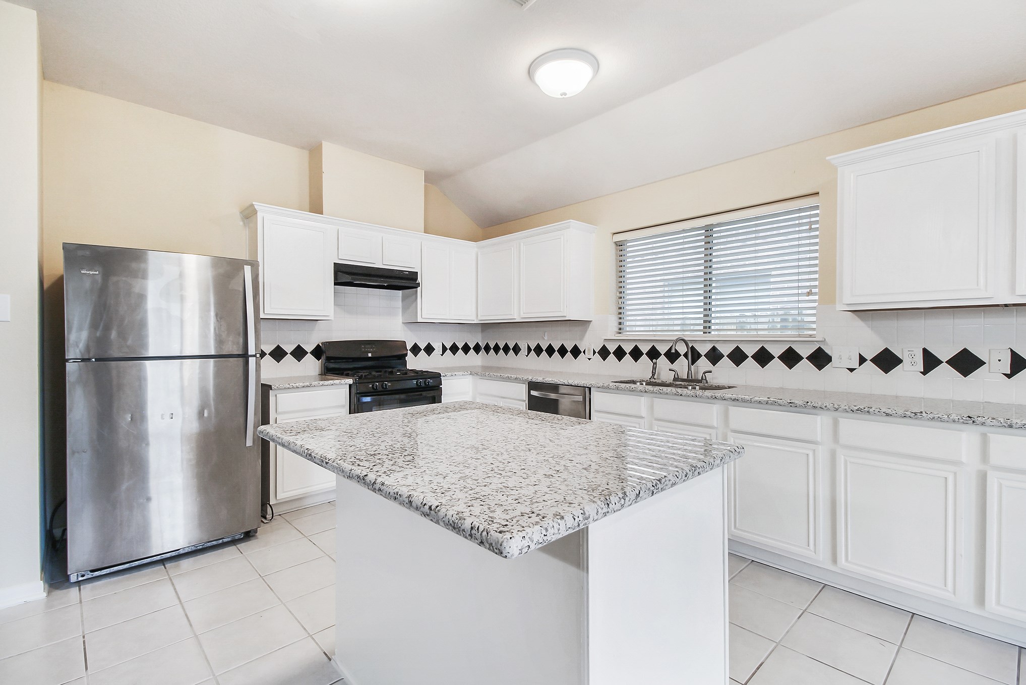 1814 Parkfair Court Katy, TX 77450 - Photo 15 of 36 Breakfast bar needs your favorite comfy Bar Stools... Notice the gas range and under cabinet vent hood. Super clean and spacious.