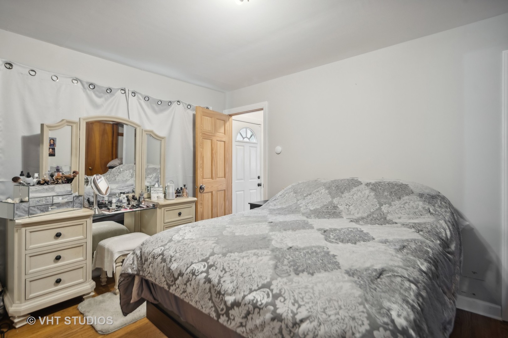 655 Thomas Street Elmhurst, IL 60126 - Photo 15 of 17 a spacious bedroom with a bed and a dresser
