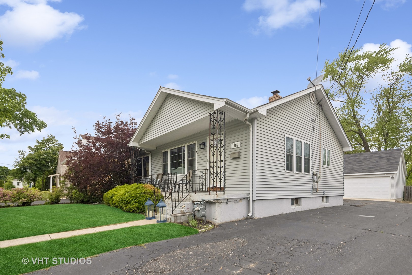 655 Thomas Street Elmhurst, IL 60126 - Photo 2 of 17 a view of a house with a yard and potted plants