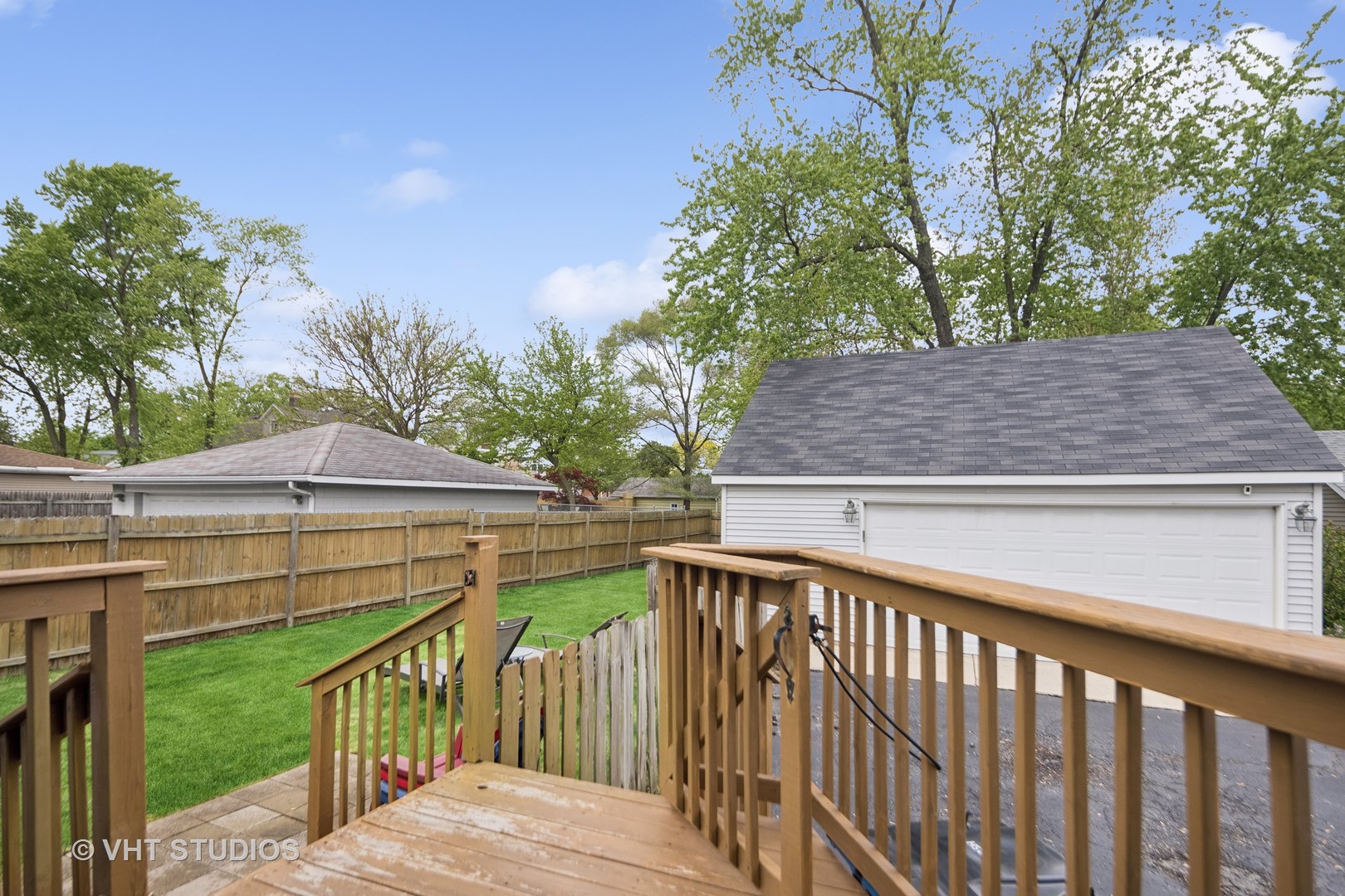 655 Thomas Street Elmhurst, IL 60126 - Photo 4 of 17 a view of a wooden bridge from a balcony