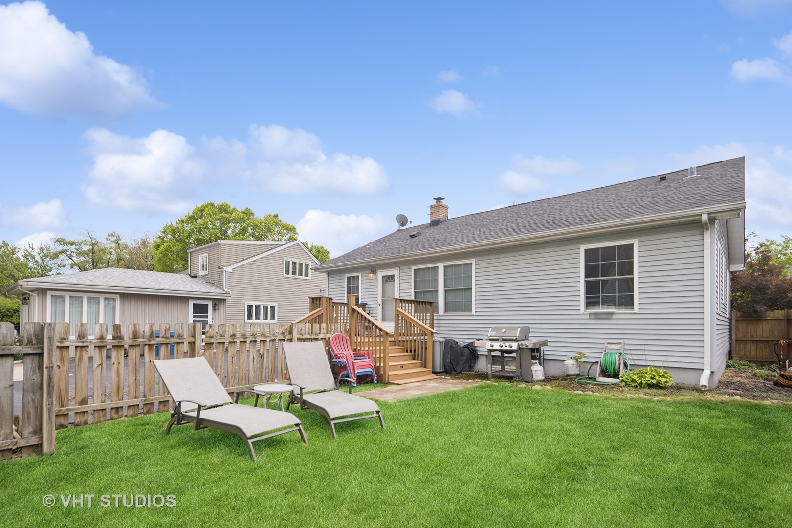 655 Thomas Street Elmhurst, IL 60126 - Photo 6 of 17 a view of a house with a backyard and chairs