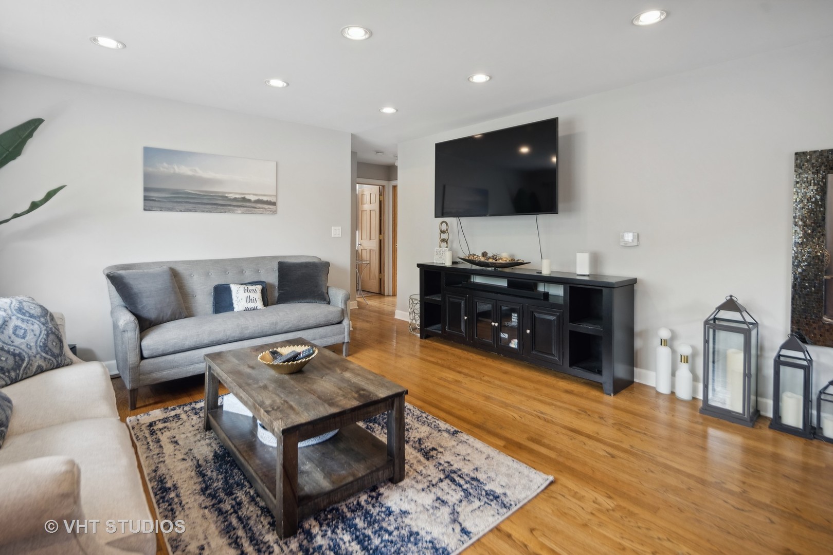 655 Thomas Street Elmhurst, IL 60126 - Photo 7 of 17 a living room with furniture and a flat screen tv