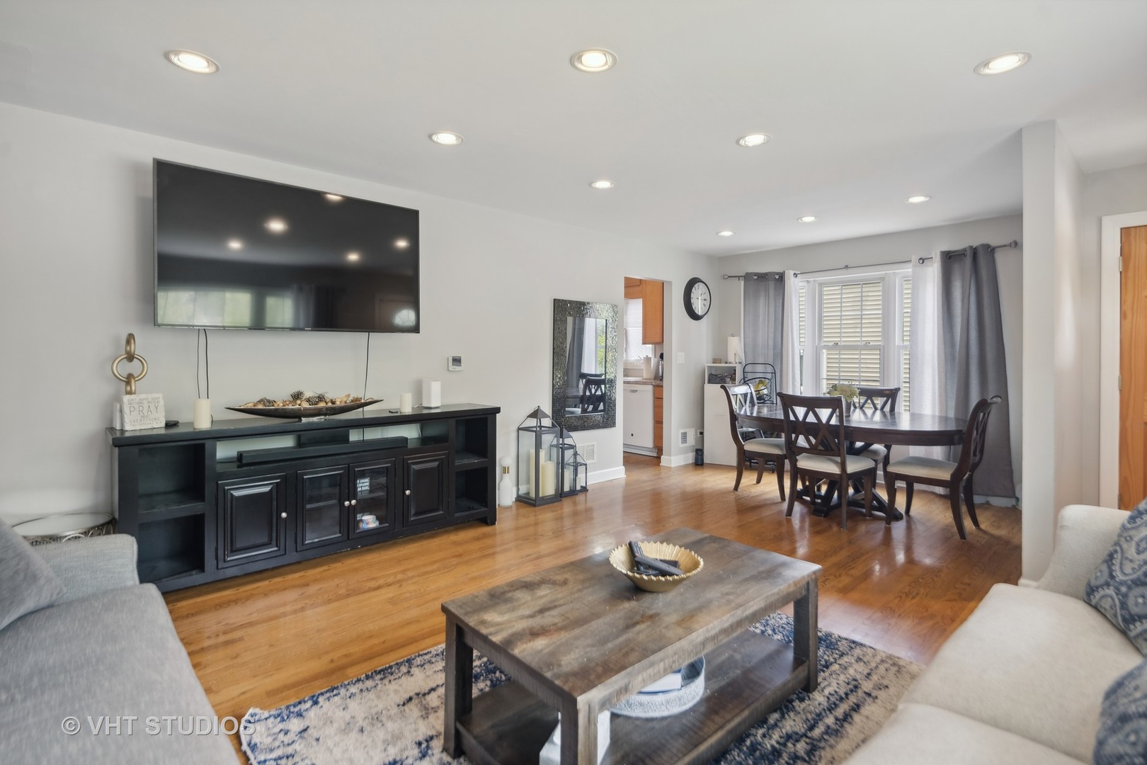 655 Thomas Street Elmhurst, IL 60126 - Photo 9 of 17 a living room with furniture and wooden floor