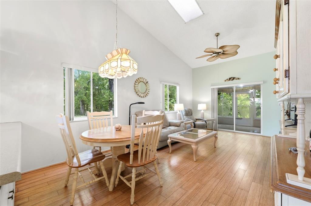 4544 Slippery Rock Road New Port Richey, FL 34653 - Photo 11 of 32 a view of a dining room with furniture window and wooden floor