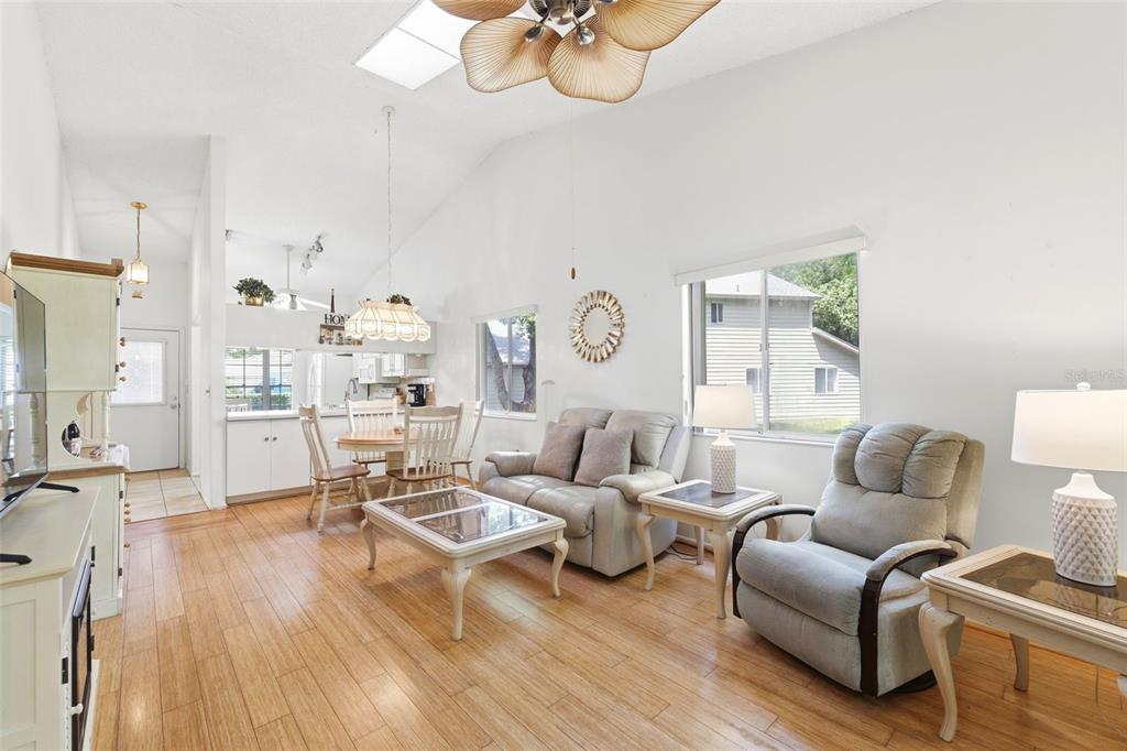 4544 Slippery Rock Road New Port Richey, FL 34653 - Photo 14 of 32 a living room with furniture kitchen view and a wooden floor