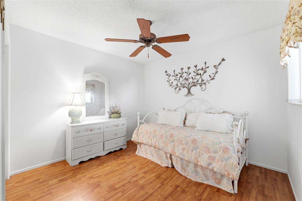 4544 Slippery Rock Road New Port Richey, FL 34653 - Photo 22 of 32 a bedroom with a bed and a window