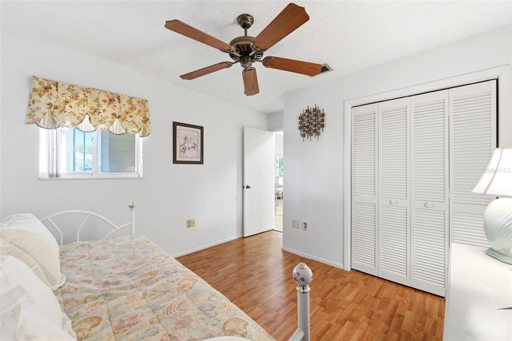 4544 Slippery Rock Road New Port Richey, FL 34653 - Photo 23 of 32 a bedroom with a bed and a window