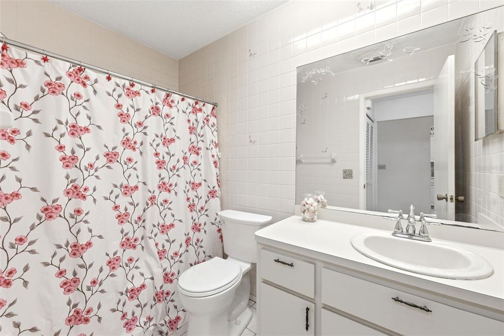 4544 Slippery Rock Road New Port Richey, FL 34653 - Photo 24 of 32 a bathroom with a sink toilet and a mirror