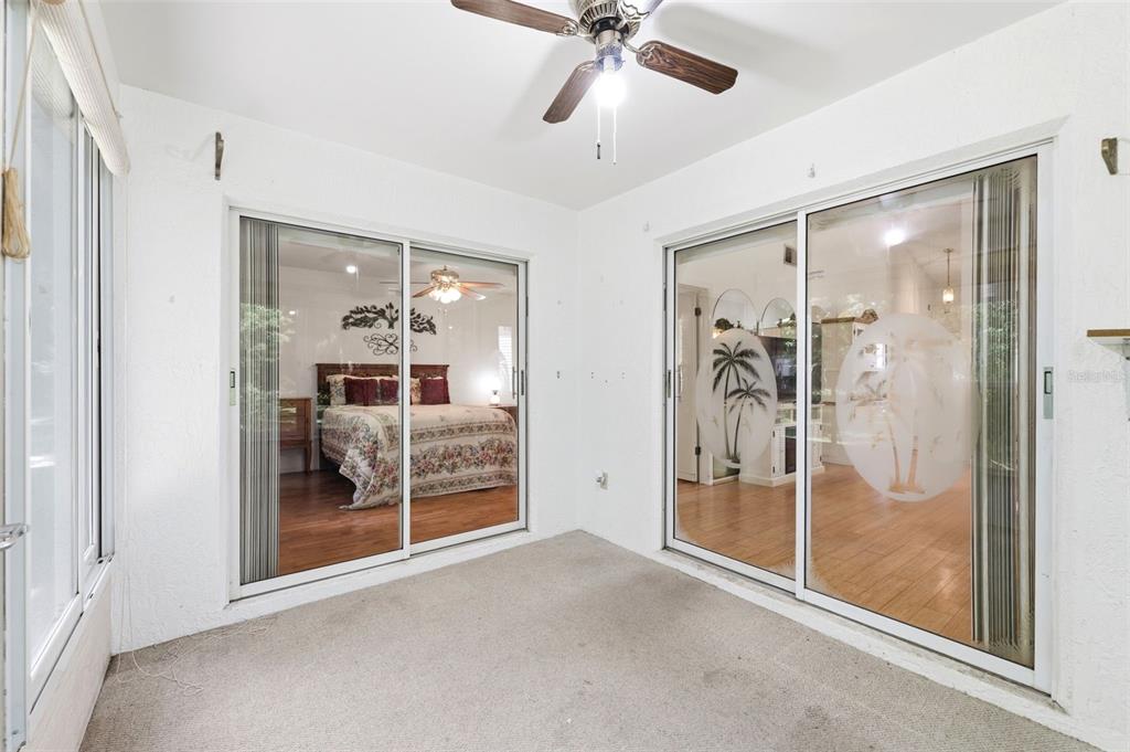 4544 Slippery Rock Road New Port Richey, FL 34653 - Photo 26 of 32 a view of a bathroom with a glass shower door and mirror