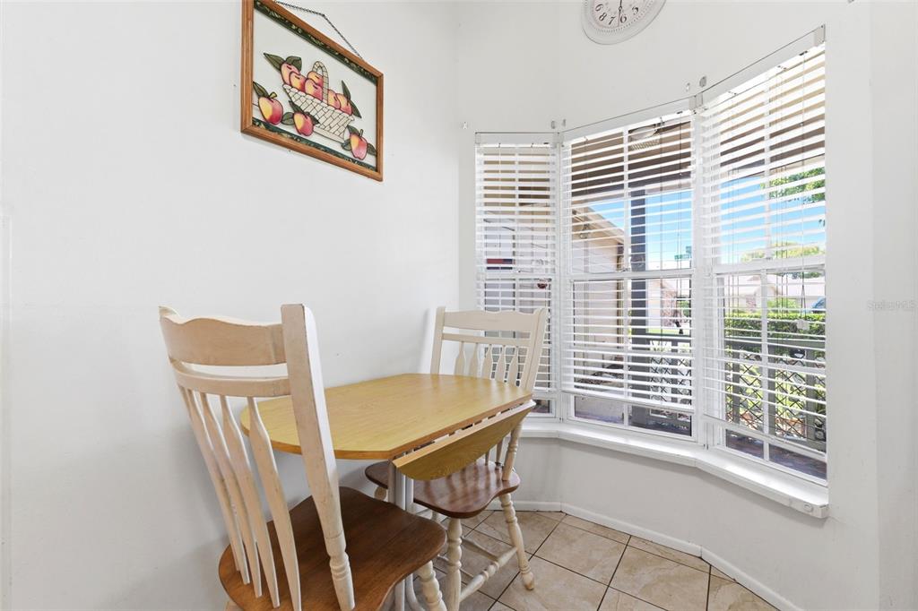 4544 Slippery Rock Road New Port Richey, FL 34653 - Photo 8 of 32 a view of a dining room with furniture and windows