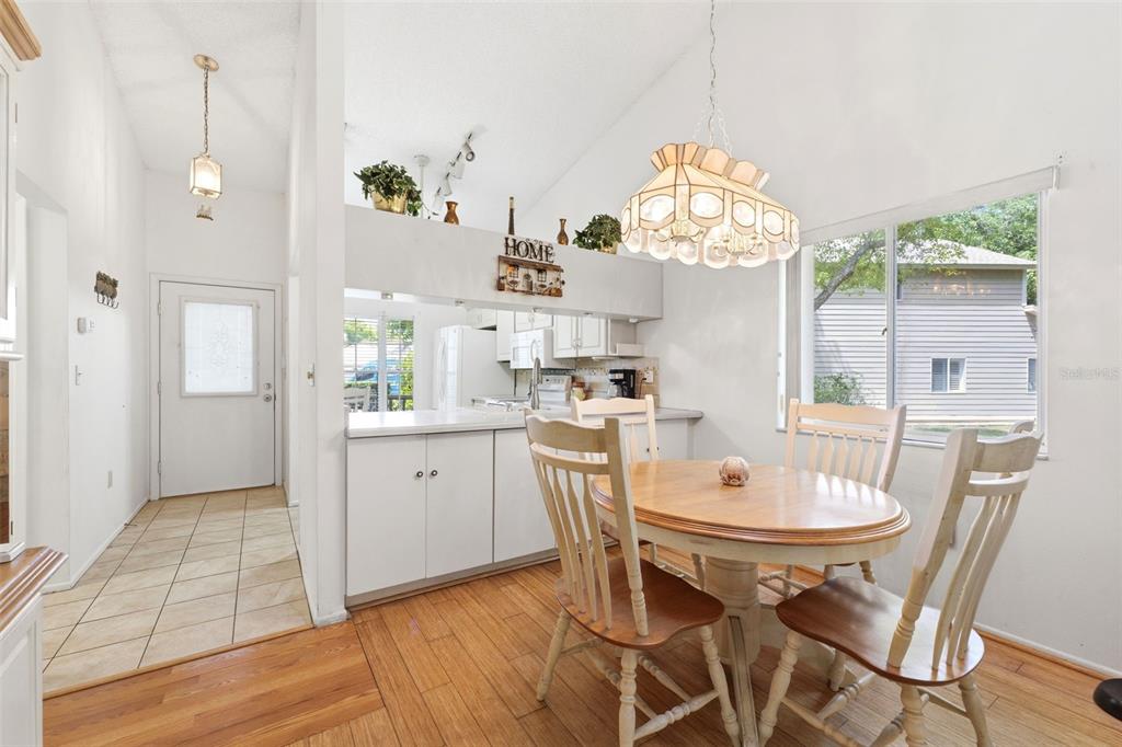 4544 Slippery Rock Road New Port Richey, FL 34653 - Photo 10 of 32 a view of a dining room with furniture window and wooden floor