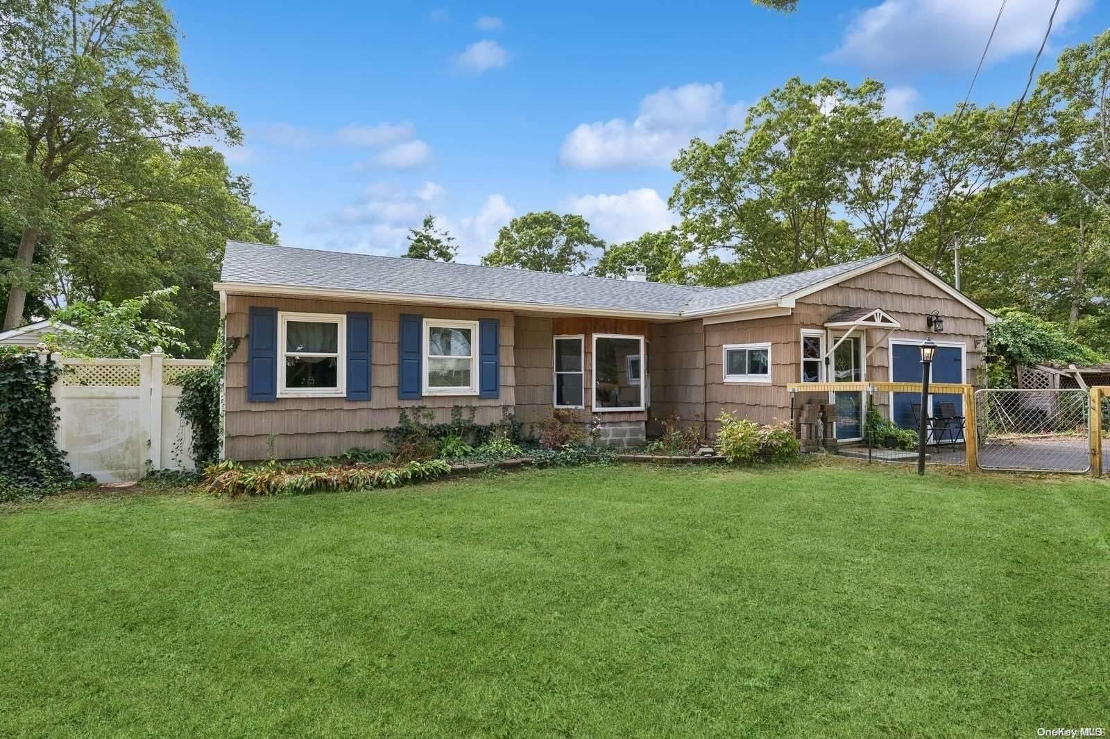 12 Fleet Road Shirley, NY 11967 - Photo 1 of 1 a front view of a house with a garden