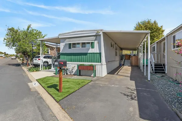 a bathroom with a sink a mirror and shower