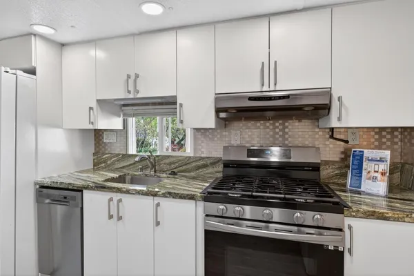 a view of a back yard of the house